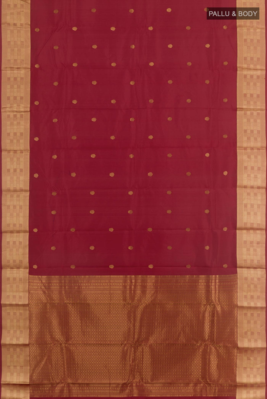 Flat view of Maroon Kanchipuram Silk Saree with Zari Butta on the body and Zari Border. 