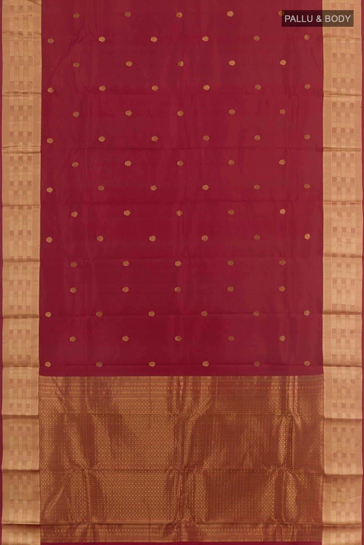Flat view of Maroon Kanchipuram Silk Saree with Zari Butta on the body and Zari Border. 