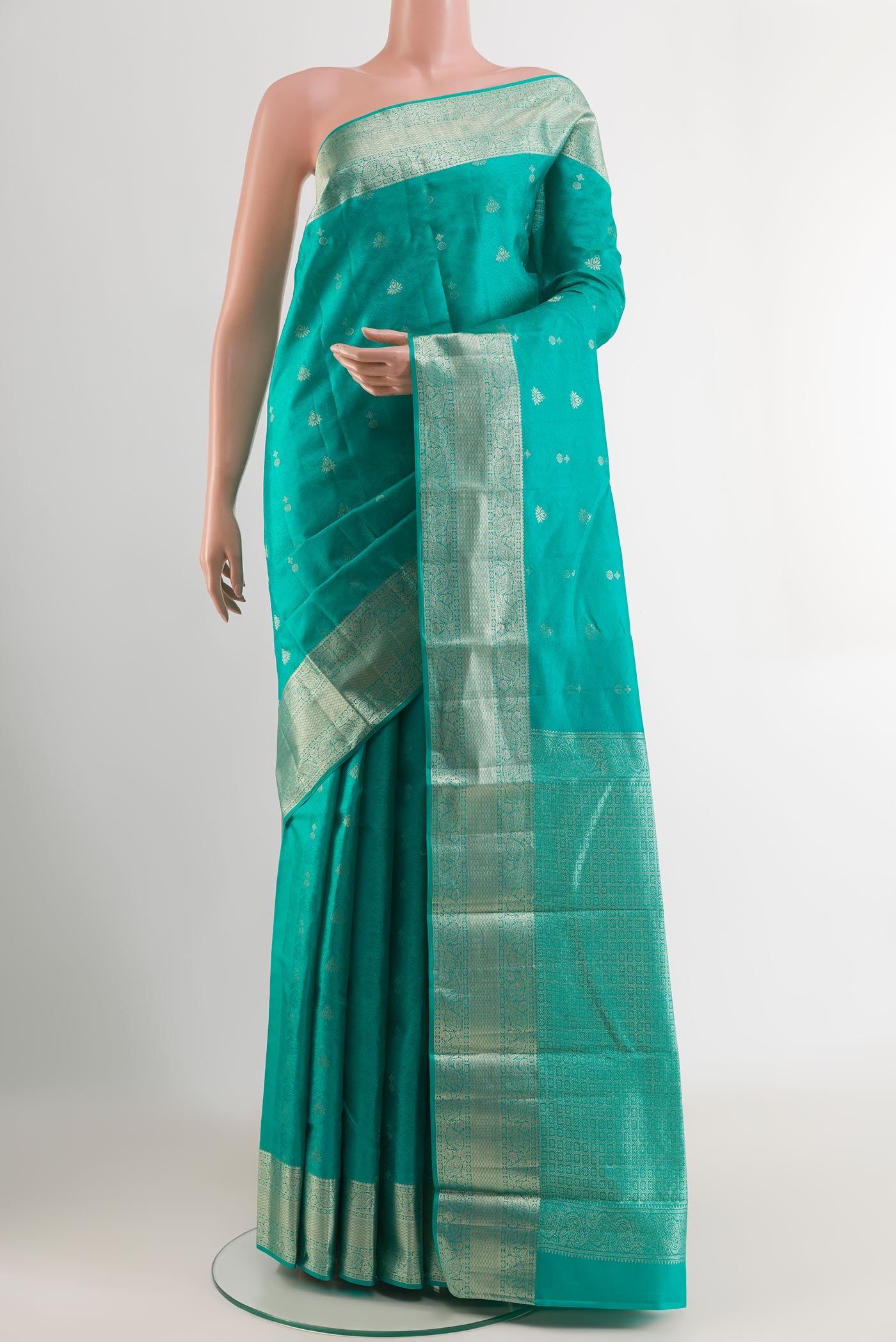 Turquoise Kanchipuram Silk Saree with Jacquard With Zari Butta on the body and Zari Border.  displayed on a mannequin