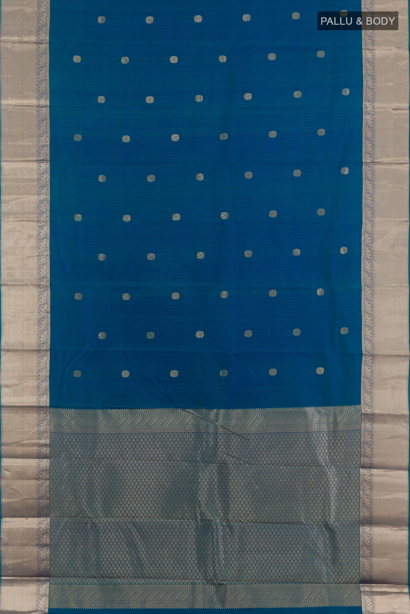 Flat view of Peacock Blue Kanchipuram Silk Saree with Jacquard With Zari Butta on the body and Zari Border. 