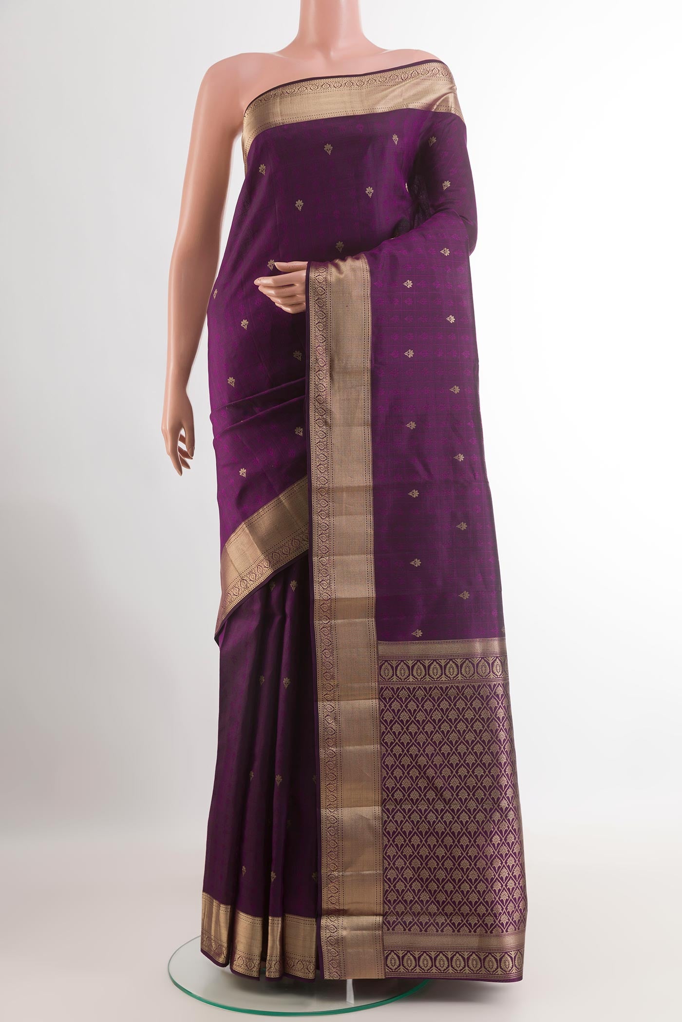 Purple Kanchipuram Silk Saree with Zari Butta on the body and Zari Border.  displayed on a mannequin