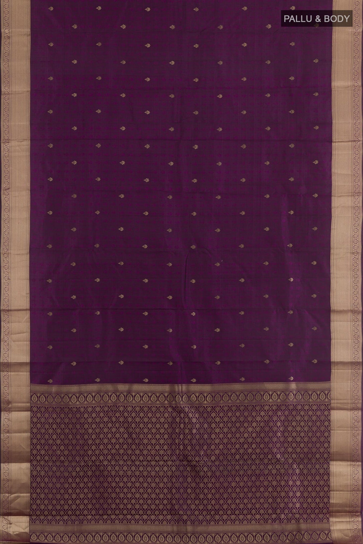 Flat view of Purple Kanchipuram Silk Saree with Zari Butta on the body and Zari Border. 
