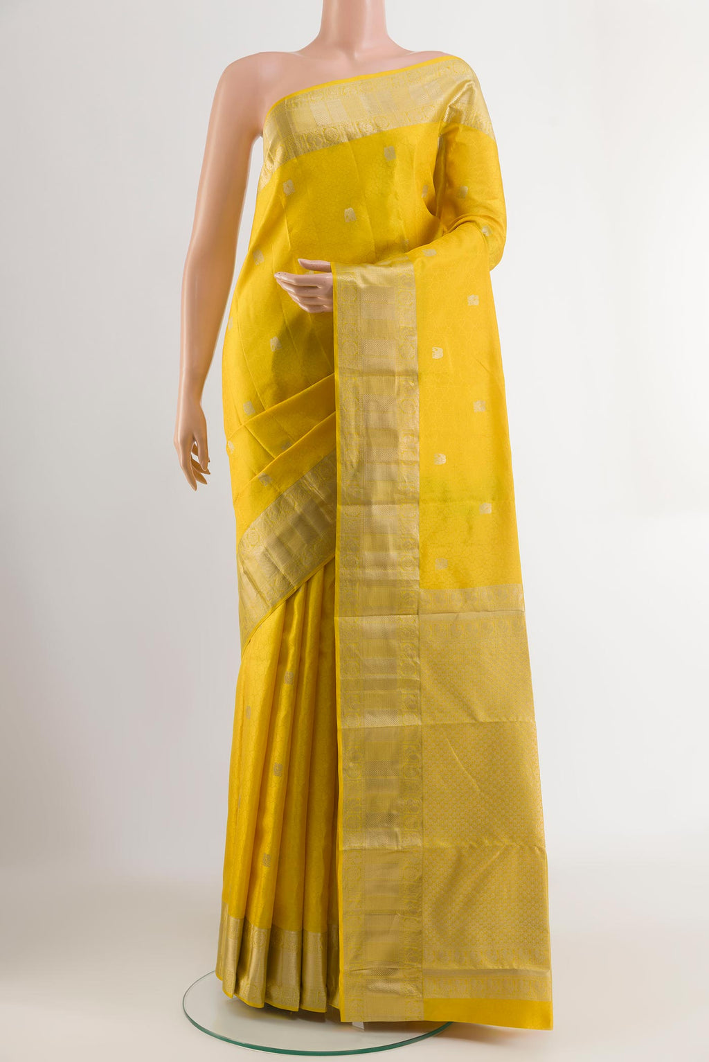 Yellow Kanchipuram Silk Saree with Jacquard With Zari Butta on the body and Zari Border.  displayed on a mannequin