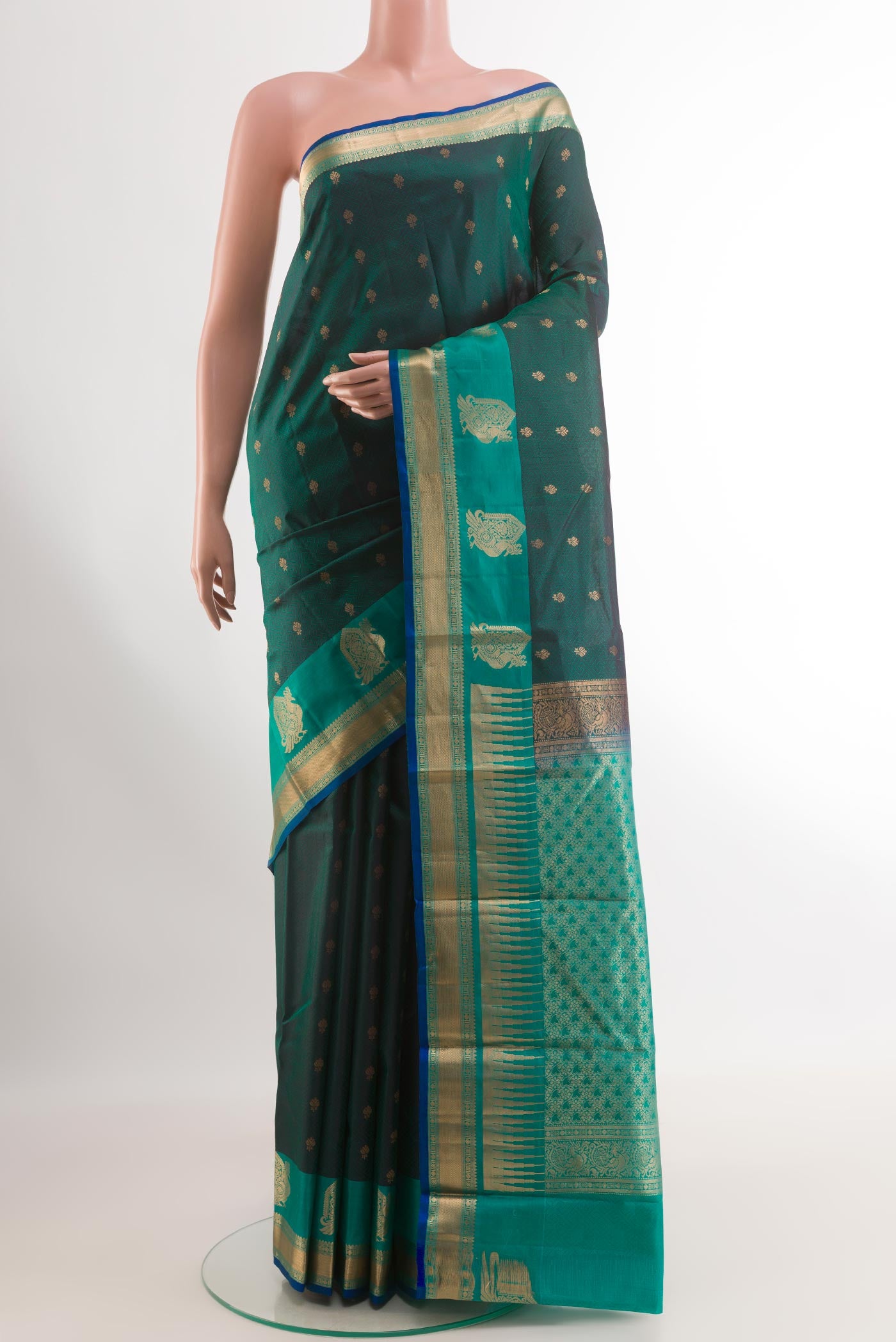 Green Kanjivaram Silk Saree with Jacquard With Zari Butta on the body and Zari Border.  displayed on a mannequin