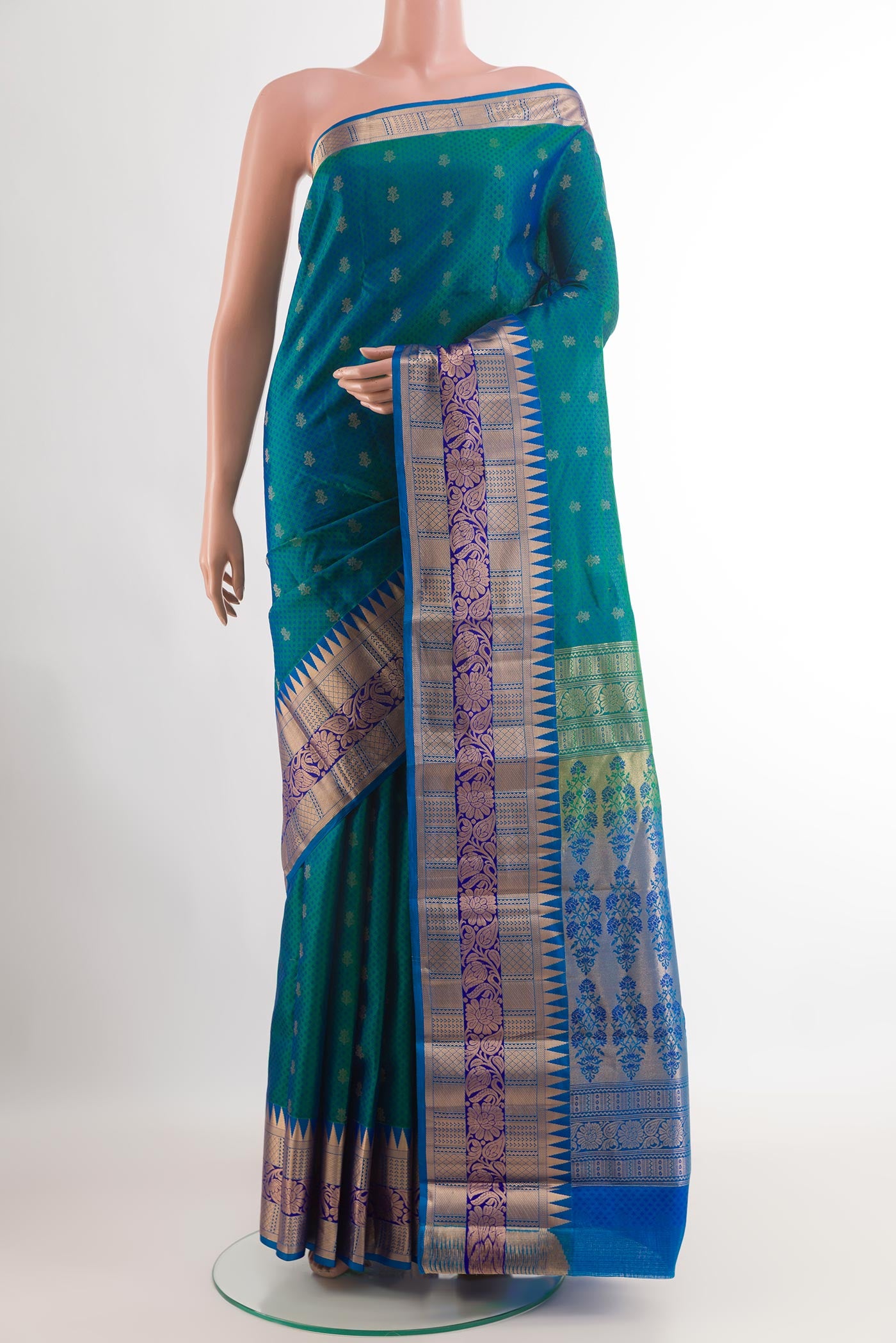 Peacock Blue Kanjivaram Silk Saree with Jacquard With Zari Butta on the body and Zari Border.  displayed on a mannequin