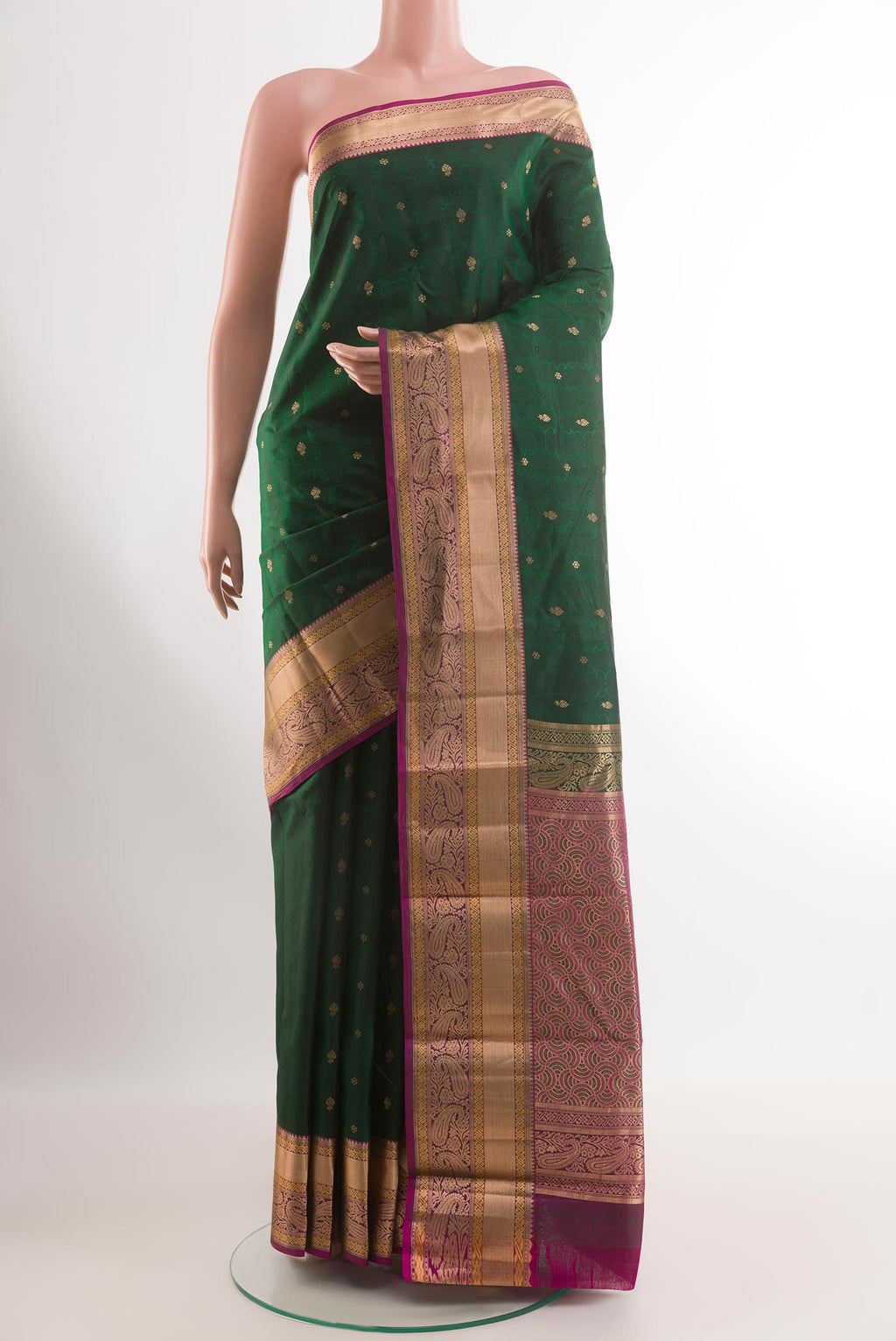 Bottle Green Kanjivaram Silk Saree with Jacquard With Zari Butta on the body and Zari Border.  displayed on a mannequin