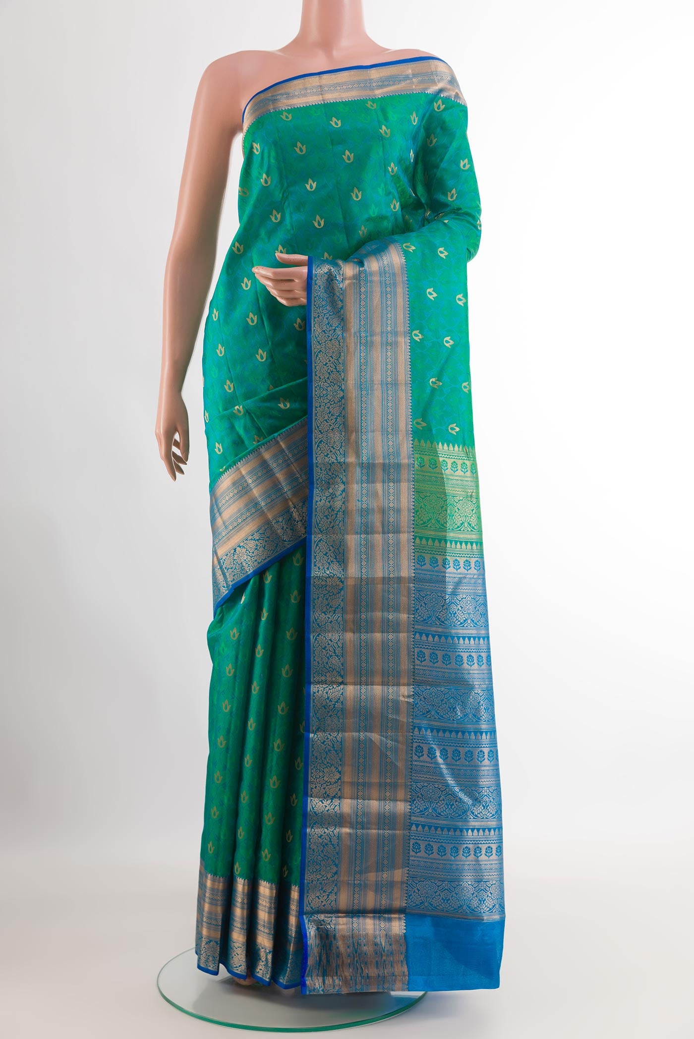 Sea Green Kanjivaram Silk Saree with Jacquard With Zari Butta on the body and Zari Border.  displayed on a mannequin