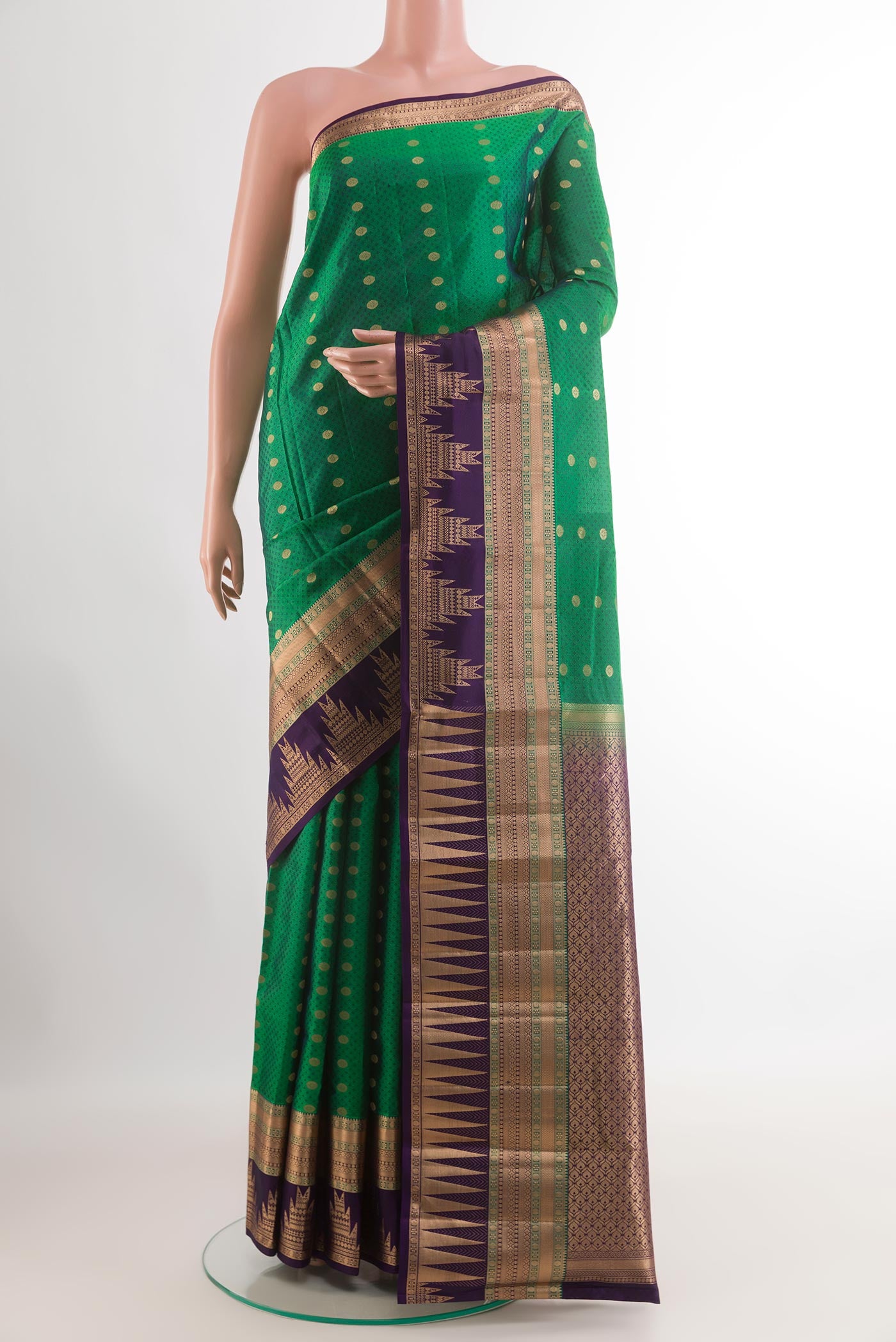 Green Kanjivaram Silk Saree with Jacquard With Zari Butta on the body and Zari Border.  displayed on a mannequin