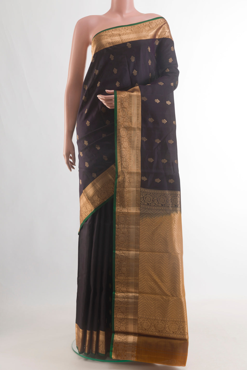 Pure Silk Black Kanjivaram Saree with Zari Butta on the body and Zari Border.  displayed on a mannequin
