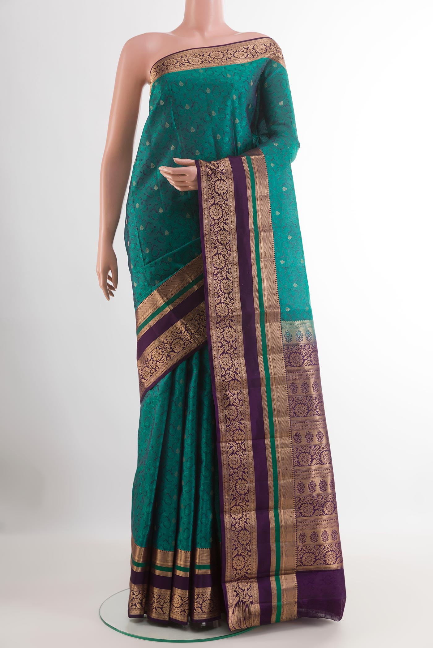 Green Kanjivaram Silk Saree with Jacquard With Zari Butta on the body and Zari Border.  displayed on a mannequin