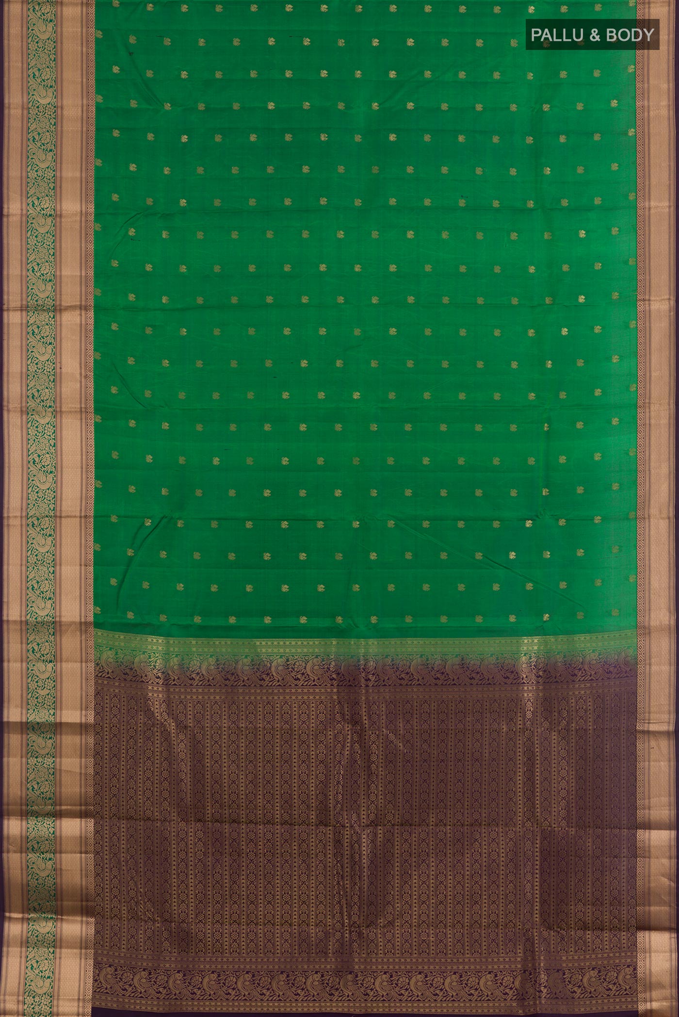 Flat view of Green Kanjivaram Silk Saree with Zari Butta on the body and Zari Border. 