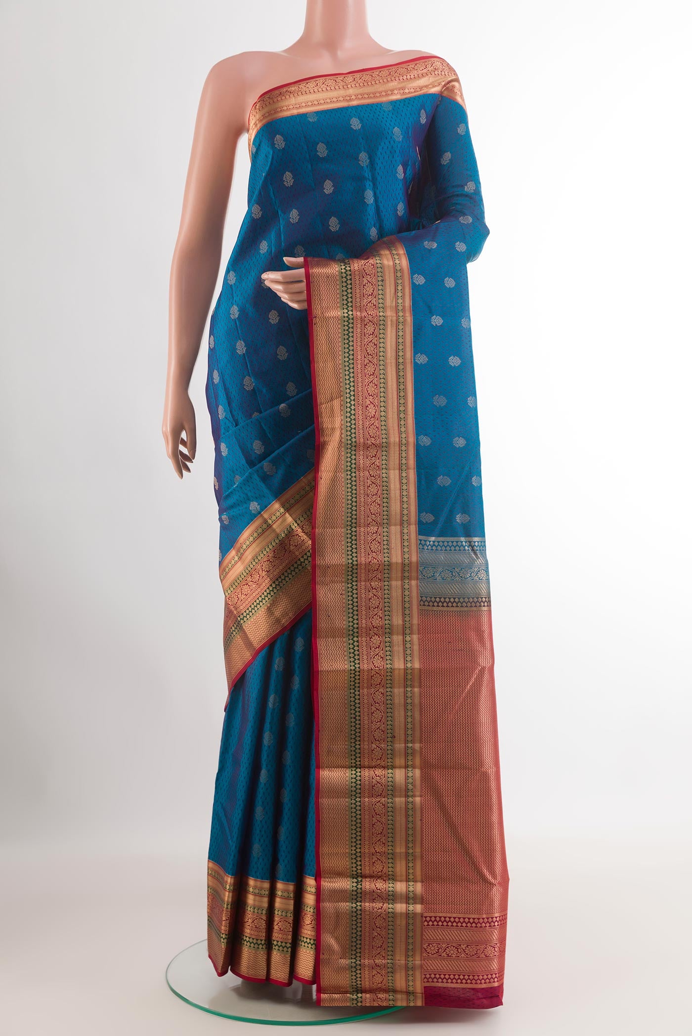 Blue Kanjivaram Silk Saree with Jacquard With Zari Butta on the body and Zari Border.  displayed on a mannequin
