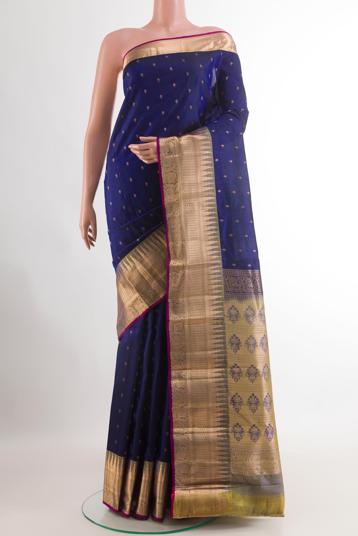 Dark Blue Kanjivaram Silk Saree with Zari Butta on the body and Zari Border.  displayed on a mannequin