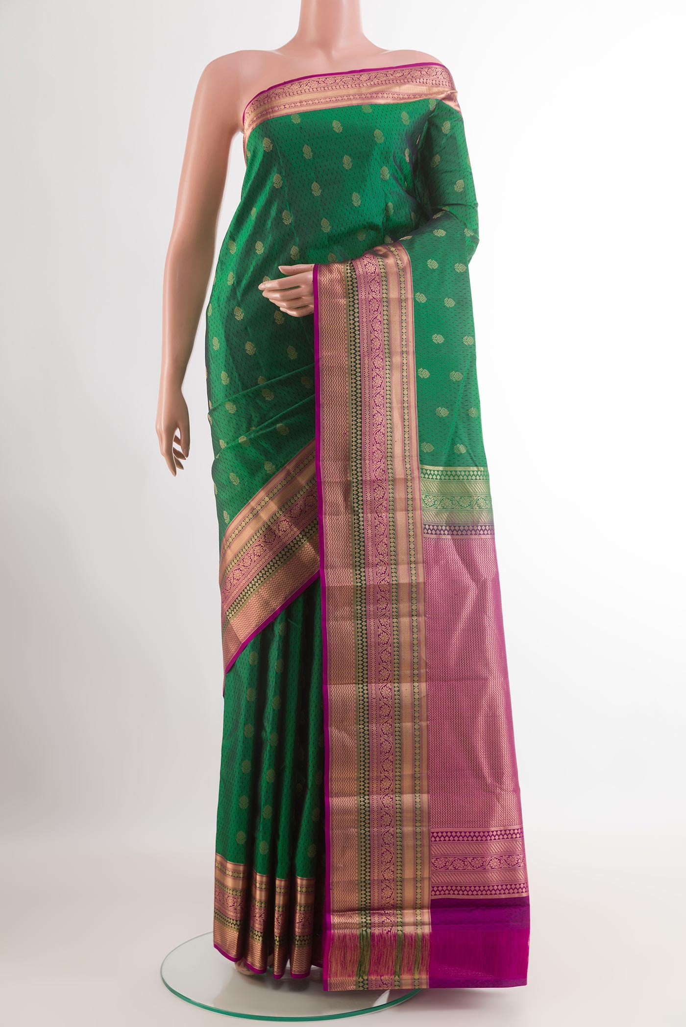 Green Kanjivaram Silk Saree with Jacquard With Zari Butta on the body and Zari Border.  displayed on a mannequin
