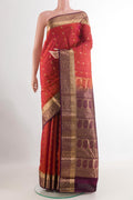 Rust Kanjivaram Silk Saree with Jacquard With Zari Butta on the body and Zari Border.  displayed on a mannequin