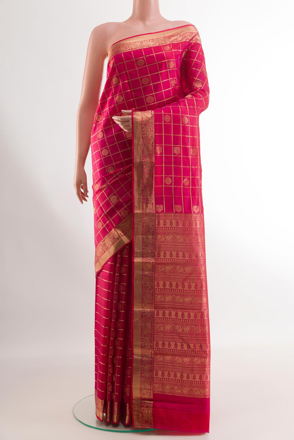 Red Kanchipuram Silk Saree with Checked design on the body and Zari Border.  displayed on a mannequin