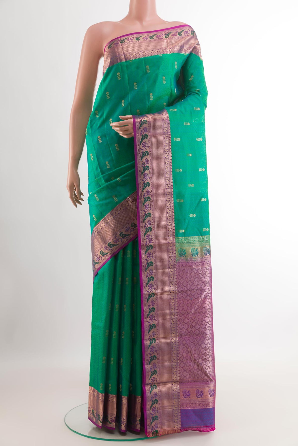 Green Kanjivaram Silk Saree with Jacquard With Zari Butta on the body and Zari Border.  displayed on a mannequin