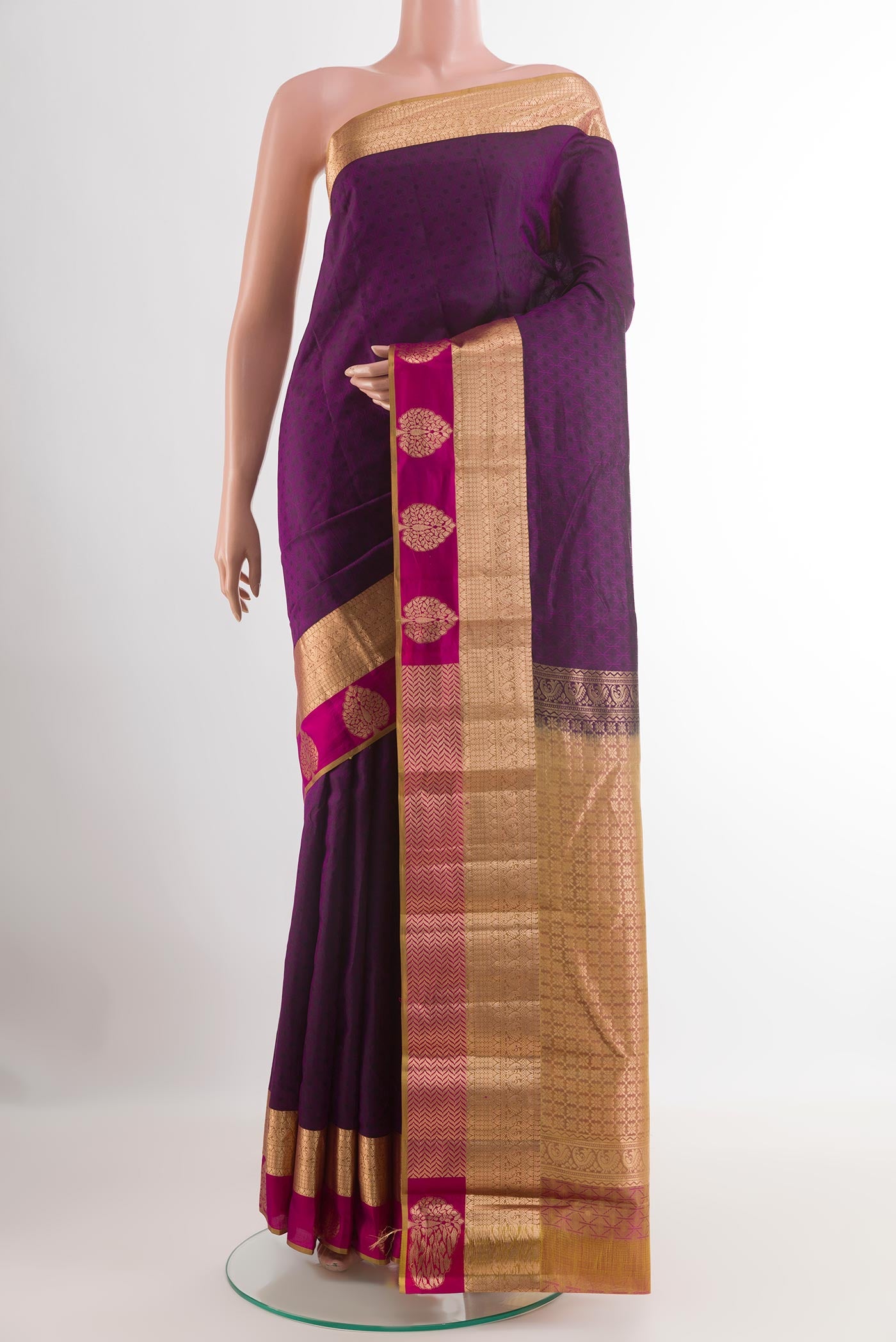 Purple Kanjivaram Silk Saree with Jacquard With Zari Butta on the body and Zari Border.  displayed on a mannequin