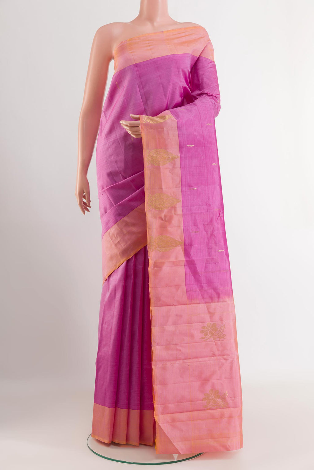Pink Kanchipuram Silk Saree with Zari Butta on the body and Zari Border.  displayed on a mannequin