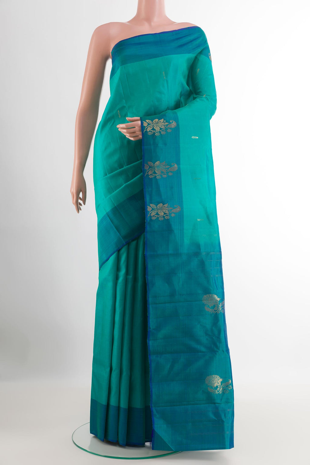 Blue Kanchipuram Silk Saree with Zari Butta on the body and Zari Border.  displayed on a mannequin