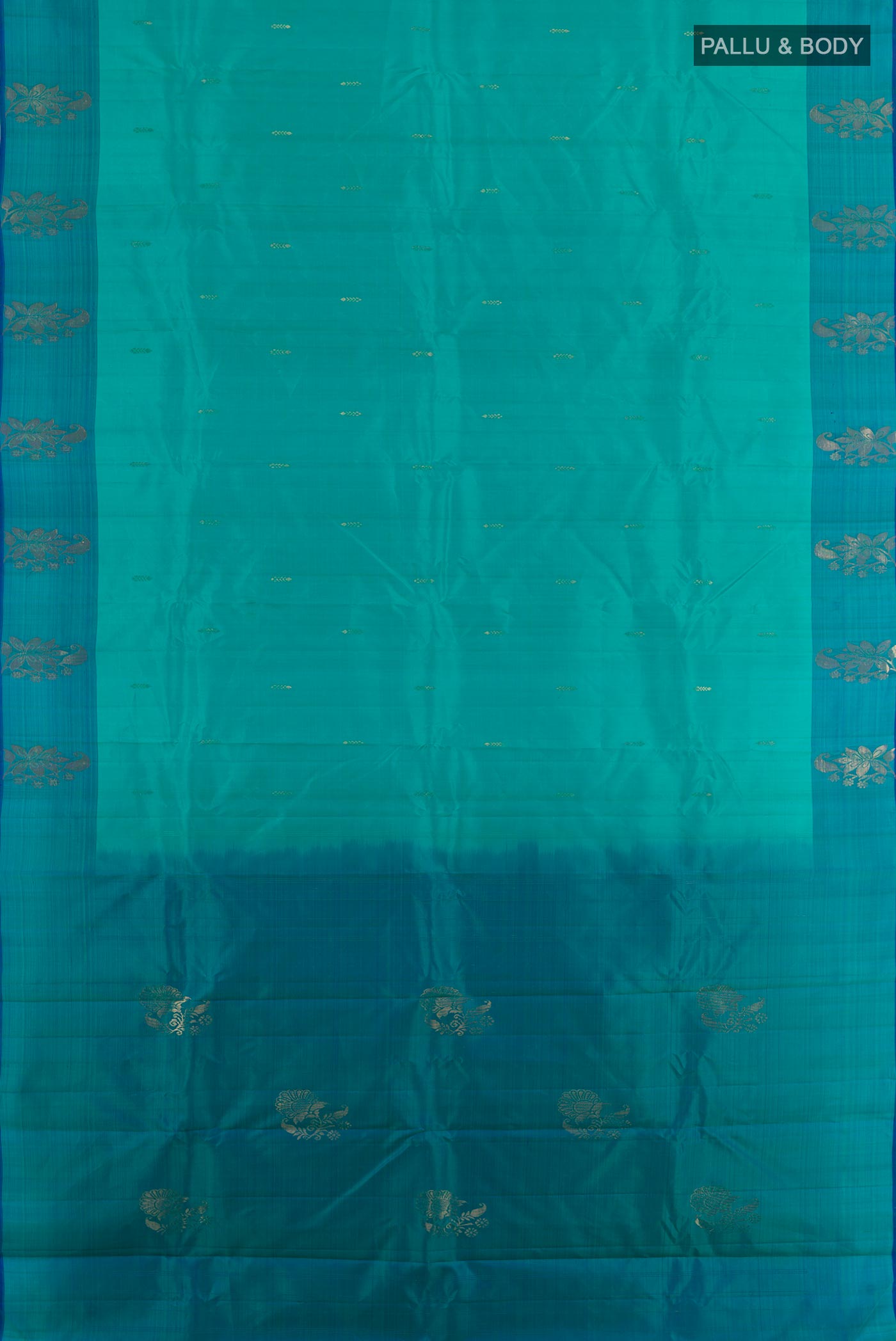 Flat view of Blue Kanchipuram Silk Saree with Zari Butta on the body and Zari Border. 