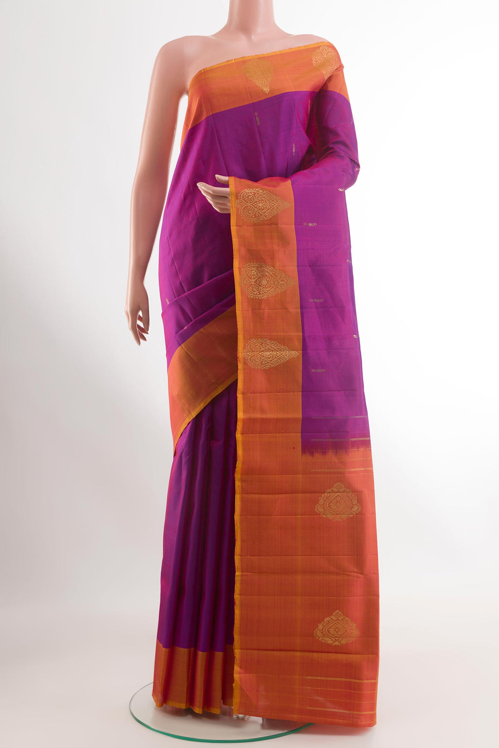 Purple Kanchipuram Silk Saree with Zari Butta on the body and Zari Border.  displayed on a mannequin