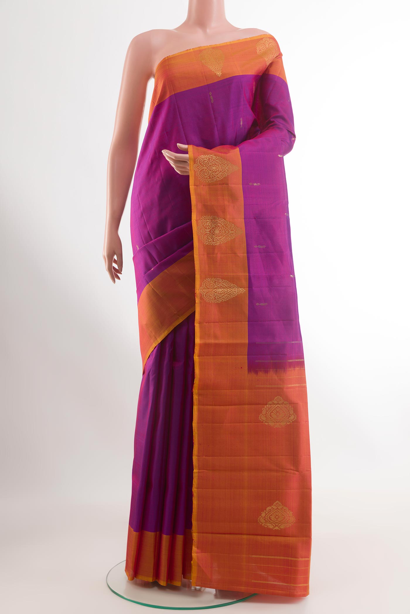 Purple Kanchipuram Silk Saree with Zari Butta on the body and Zari Border.  displayed on a mannequin
