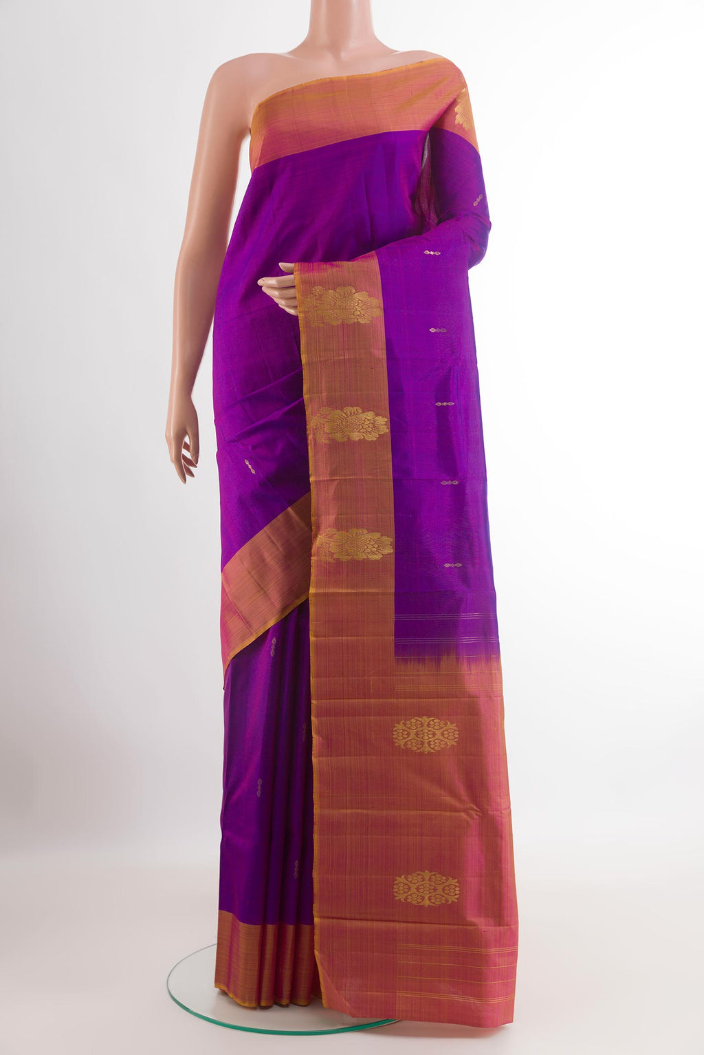Purple Kanchipuram Silk Saree with Zari Butta on the body and Zari Border.  displayed on a mannequin