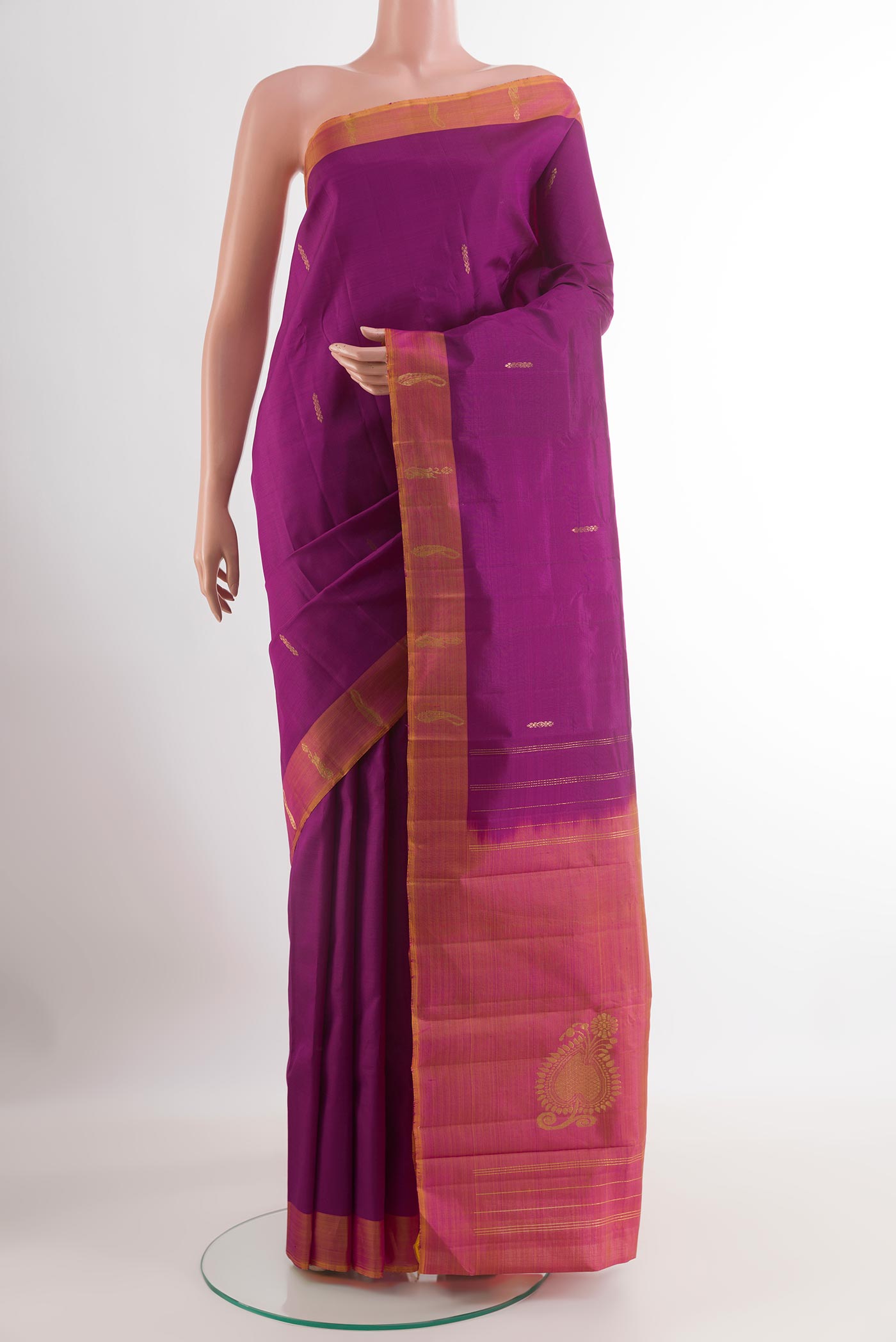 Purple Kanchipuram Silk Saree with Zari Butta on the body and Zari Border.  displayed on a mannequin