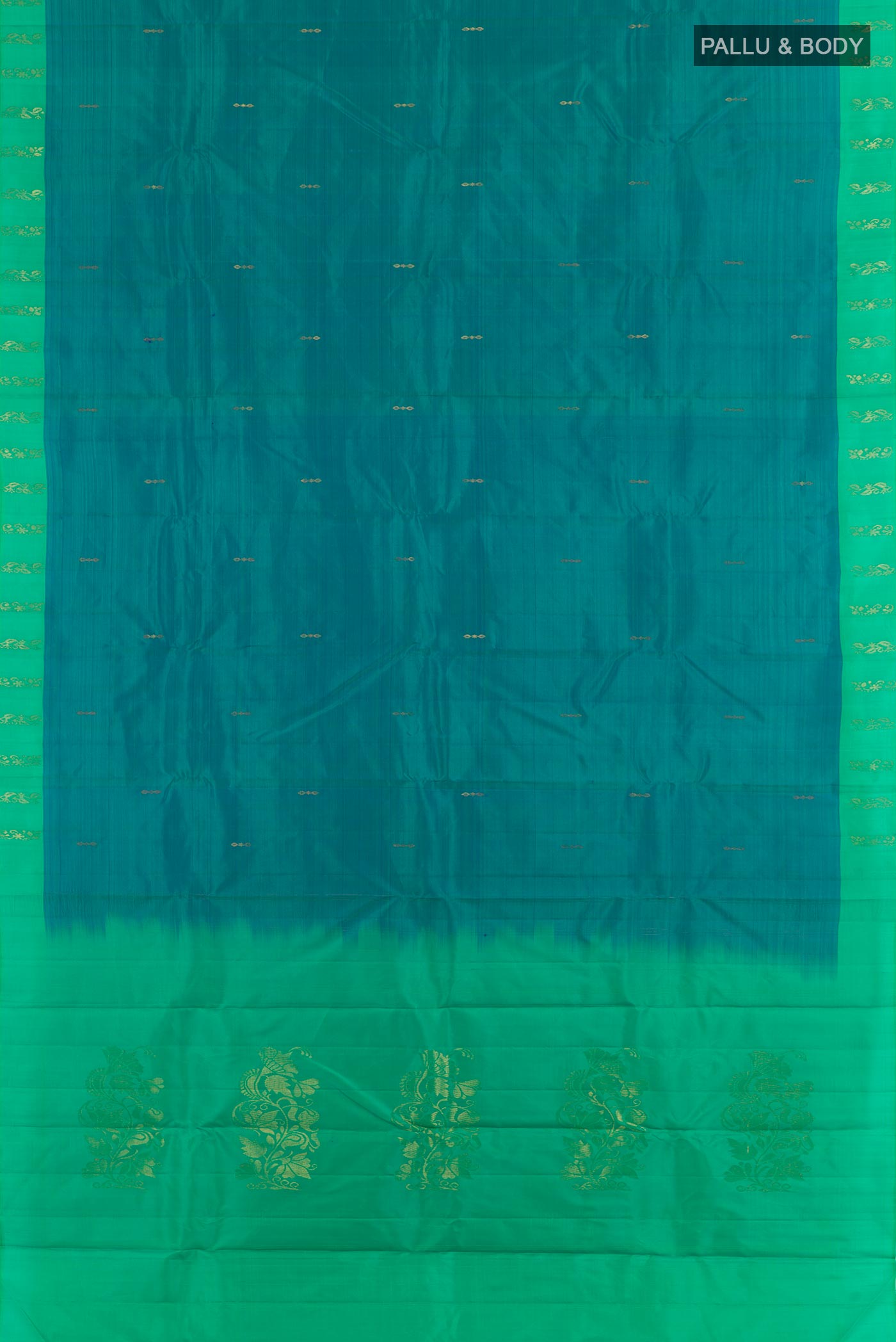 Flat view of Peacock Blue Kanchipuram Silk Saree with Zari Butta on the body and Zari Border. 