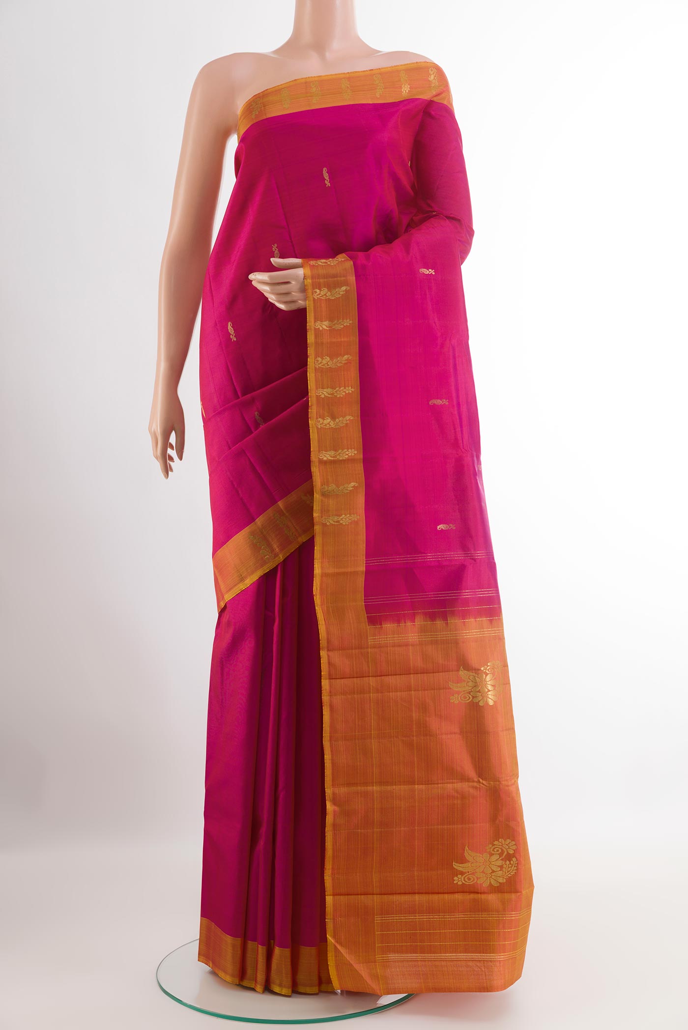 Pink Kanchipuram Silk Saree with Zari Butta on the body and Zari Border.  displayed on a mannequin