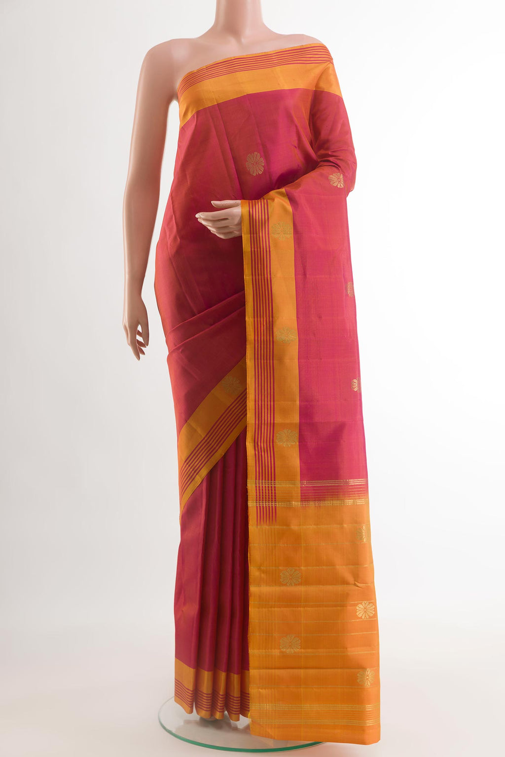 Red Kanchipuram Silk Saree with Zari Butta on the body and Zari Border.  displayed on a mannequin