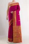 Pink Kanchipuram Silk Saree with Zari Butta on the body and Zari Border.  displayed on a mannequin