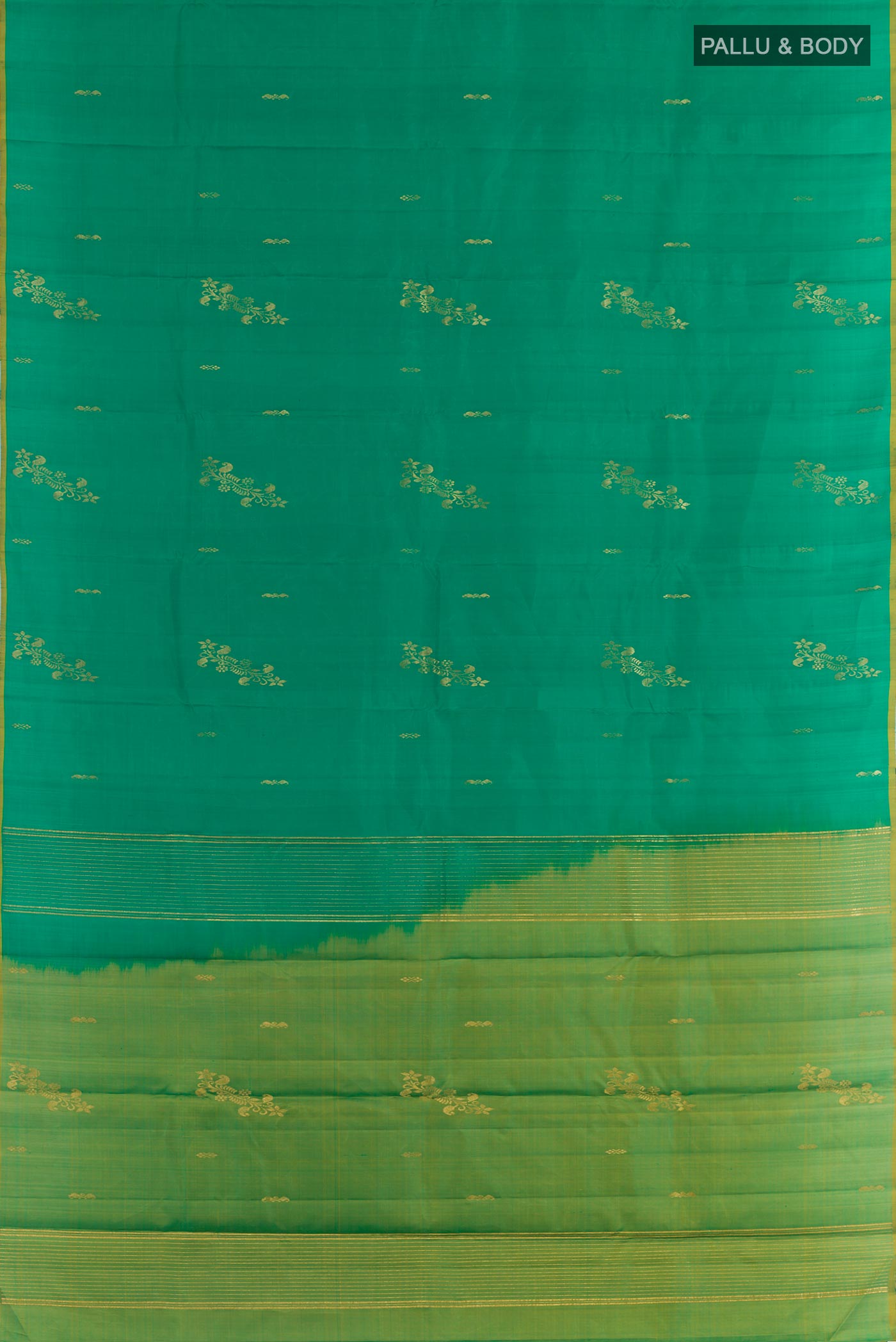 Flat view of Green Kanchipuram Silk Saree with Zari Butta on the body and Zari Border. 