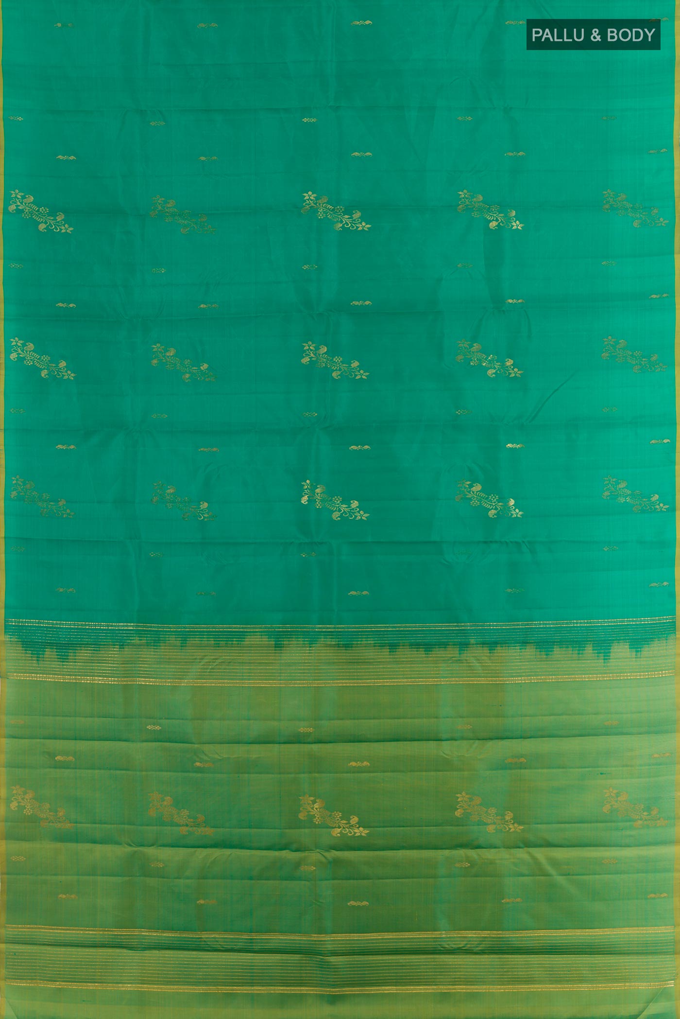 Flat view of Green Kanchipuram Silk Saree with Zari Butta on the body and Zari Border. 