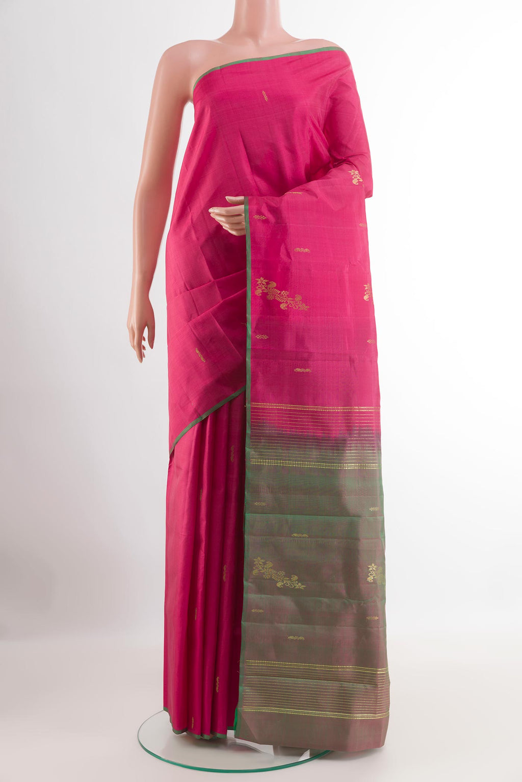 Pink Kanchipuram Silk Saree with Zari Butta on the body and Zari Border.  displayed on a mannequin