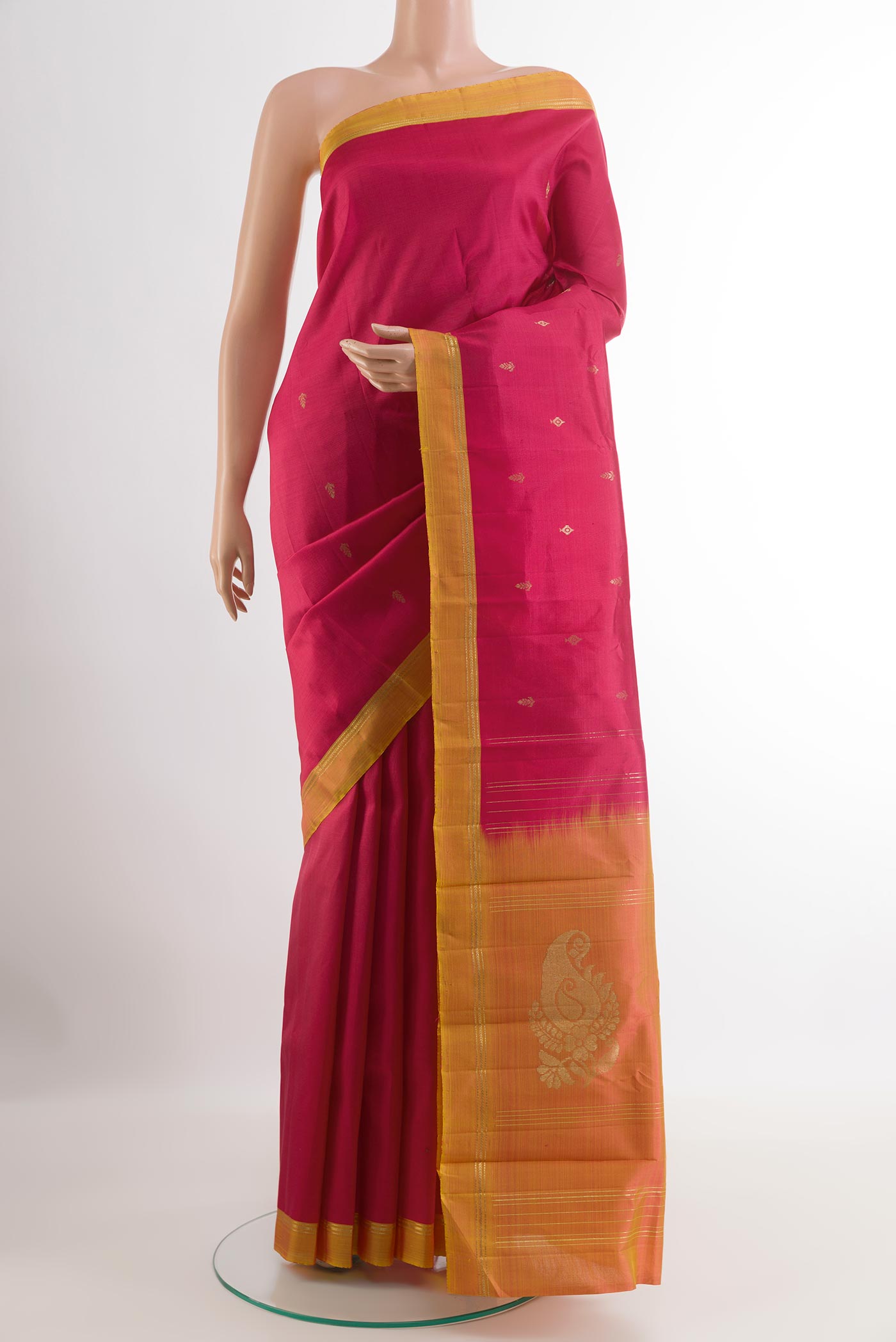 Red Kanchipuram Silk Saree with Zari Butta on the body and Zari Border.  displayed on a mannequin