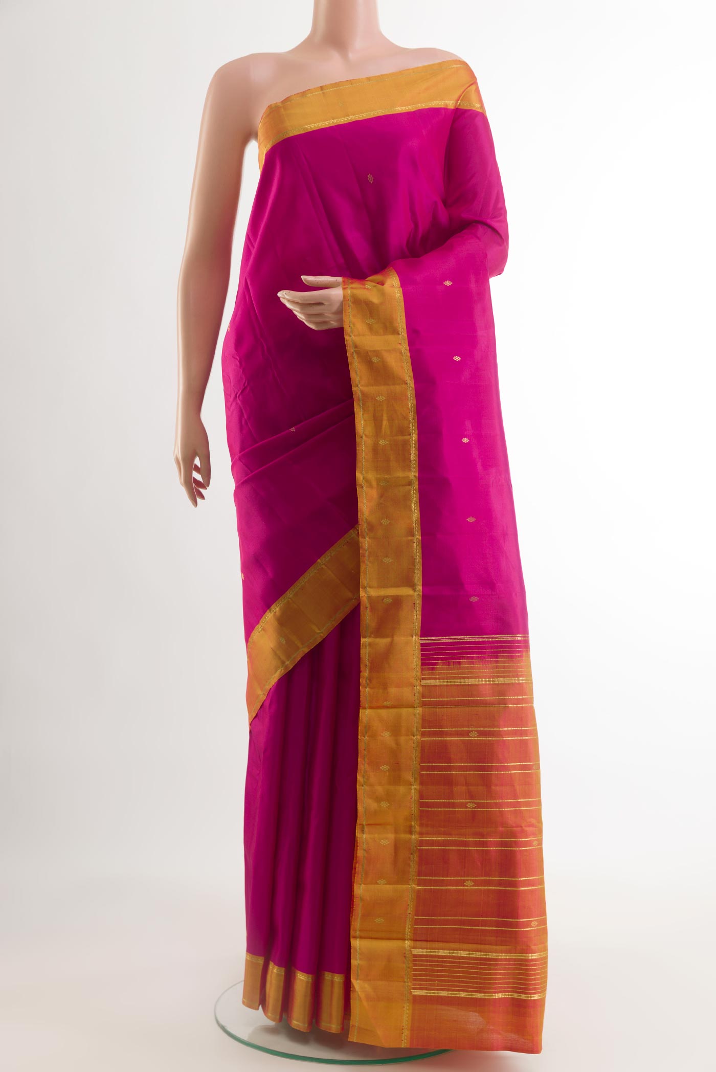 Pink Kanchipuram Silk Saree with Zari Butta on the body and Zari Border.  displayed on a mannequin