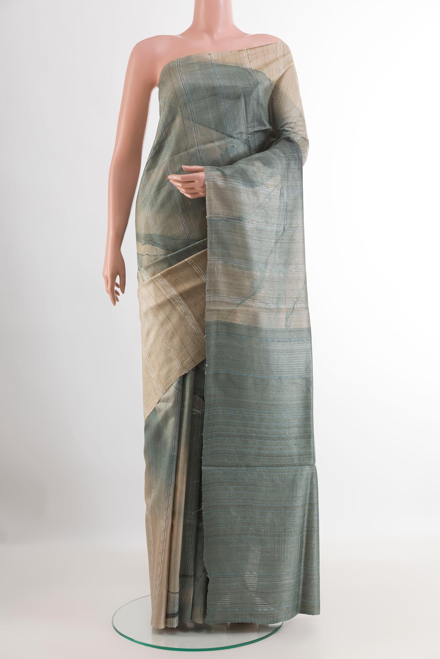 Green Tussar Saree with Printed design on the body and Without Border.  displayed on a mannequin