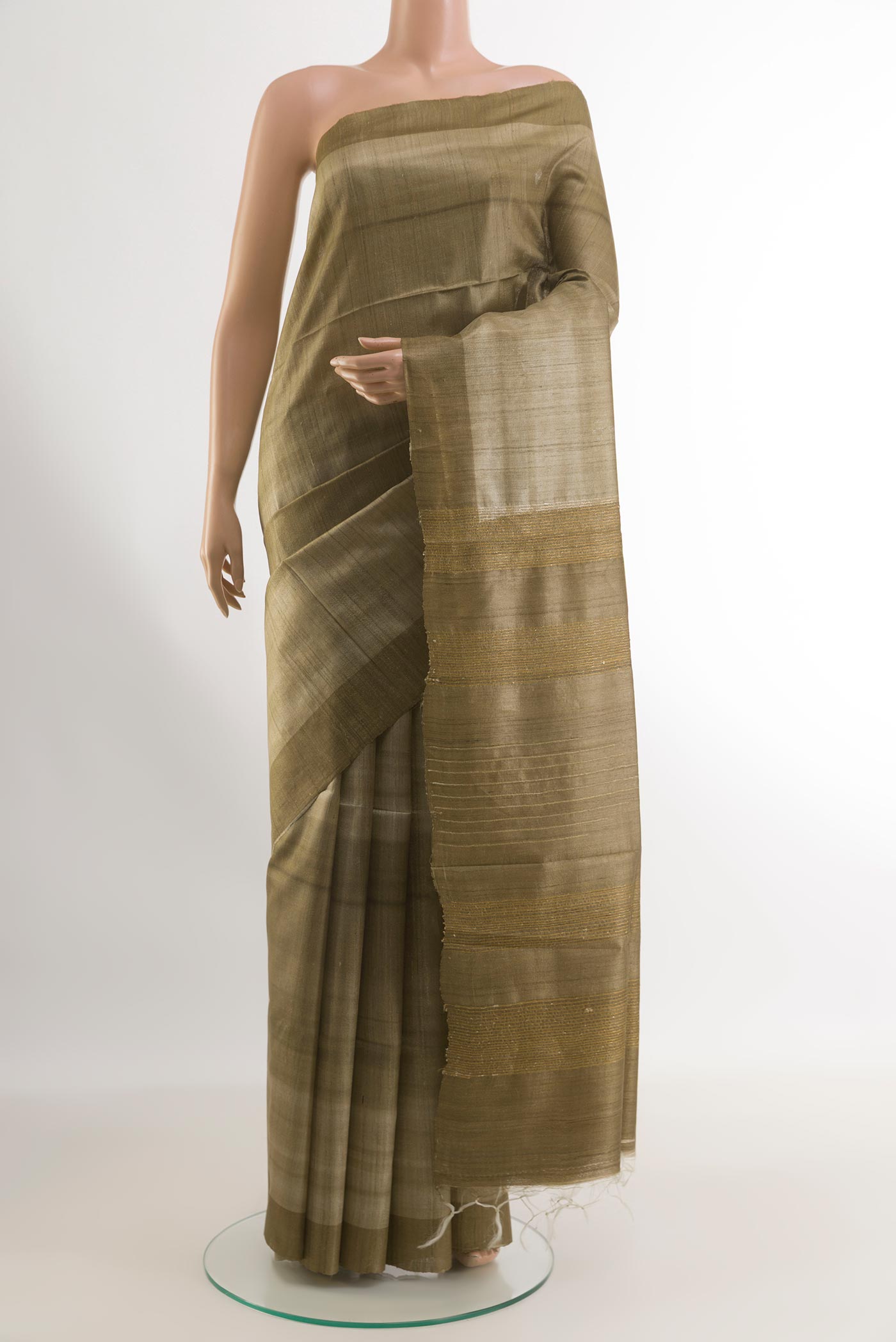Beige Tussar Silk Saree with Printed design on the body and Printed Border.  displayed on a mannequin