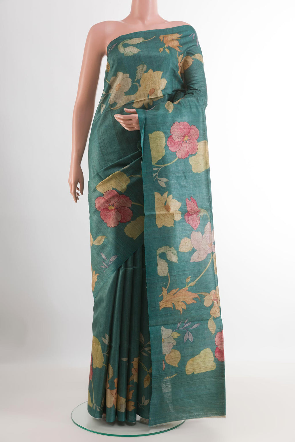 Sea Green Tussar Saree with Printed design on the body and Without Border.  displayed on a mannequin
