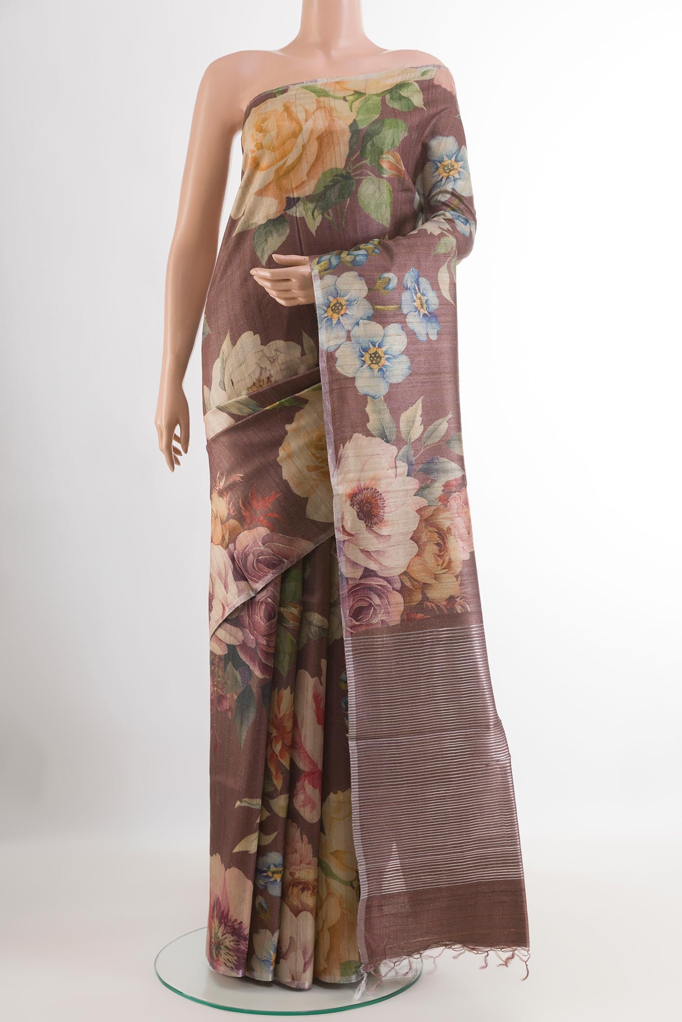 Lavender Tussar Saree with Printed design on the body and Zari Border.  displayed on a mannequin
