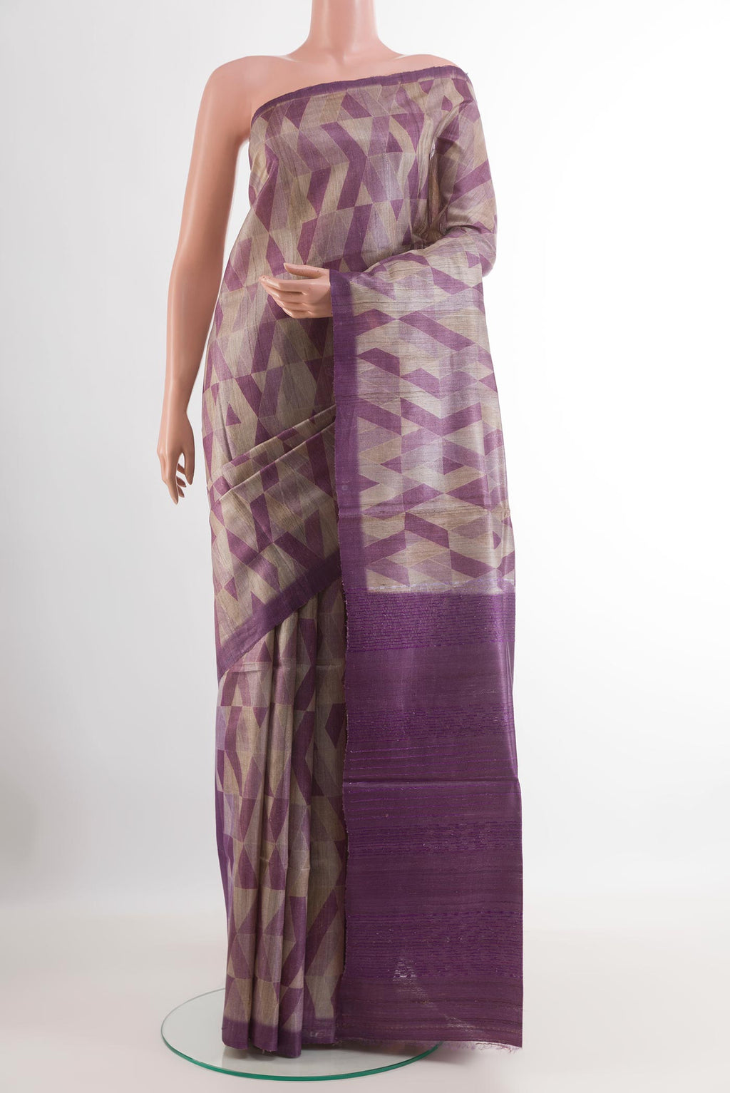 Purple Tussar Saree with Printed design on the body and Zari Border.  displayed on a mannequin