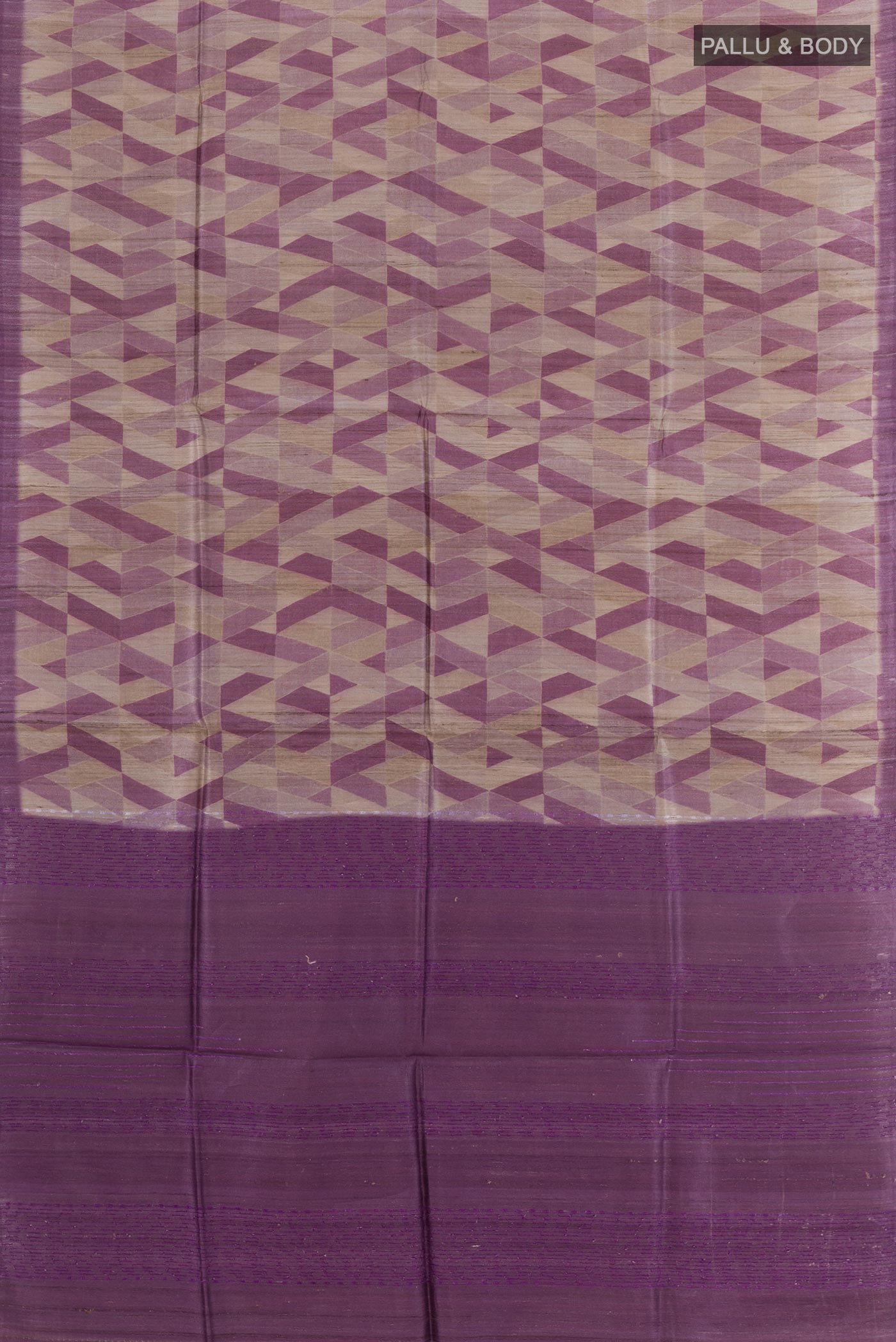 Flat view of Purple Tussar Saree with Printed design on the body and Zari Border. 