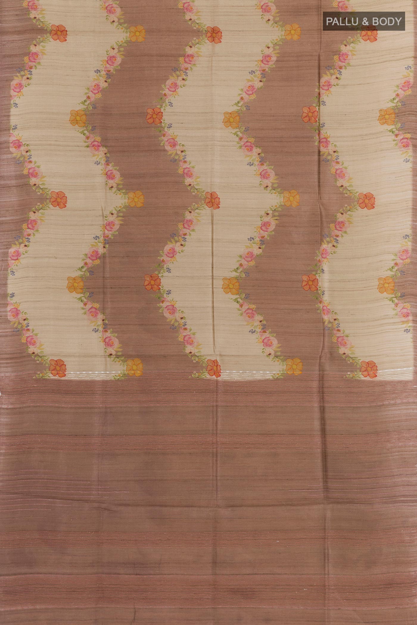 Flat view of Beige Tussar Saree with Printed design on the body and Zari Border. 