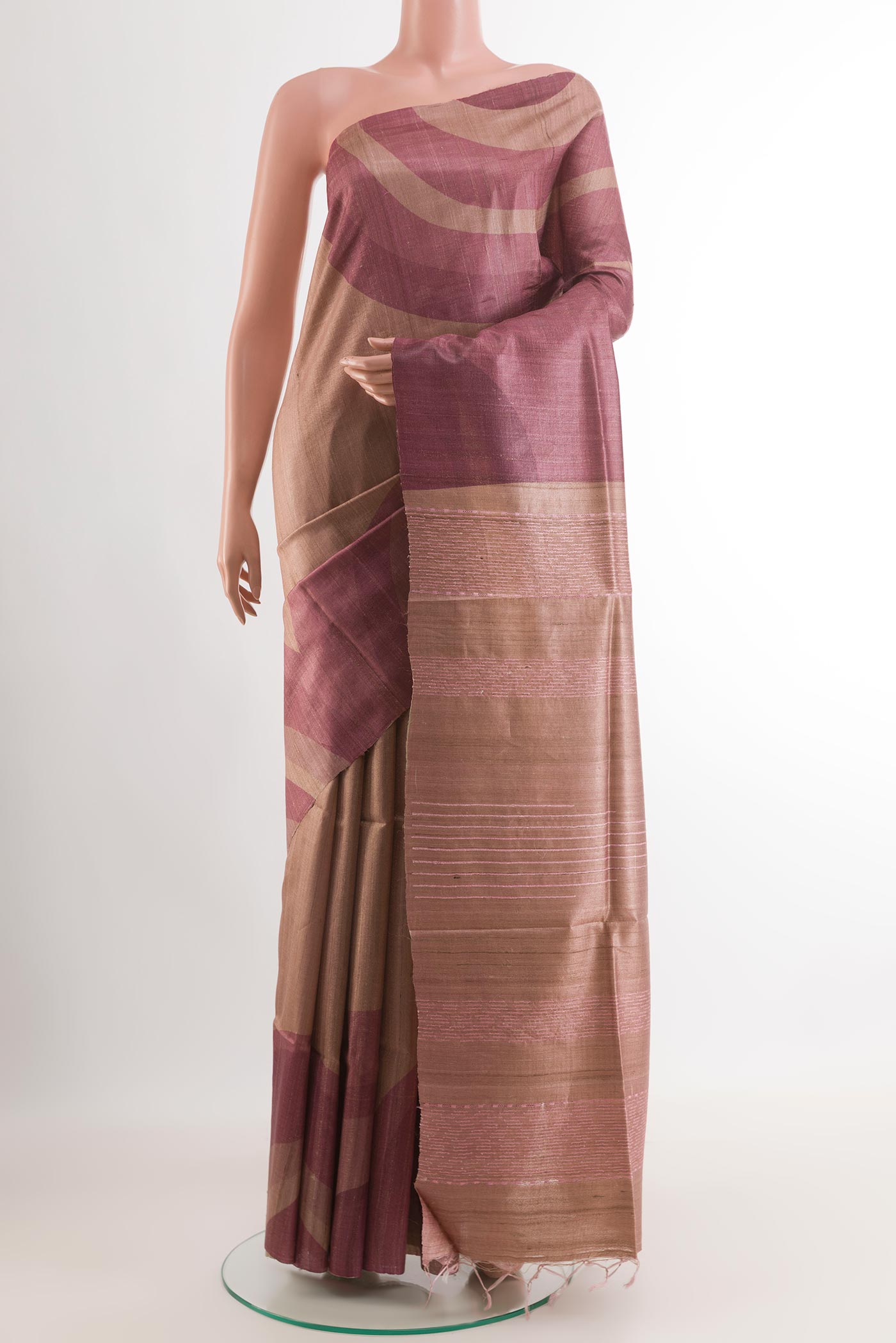 Magenta Tussar Saree with Printed design on the body and Zari Border.  displayed on a mannequin