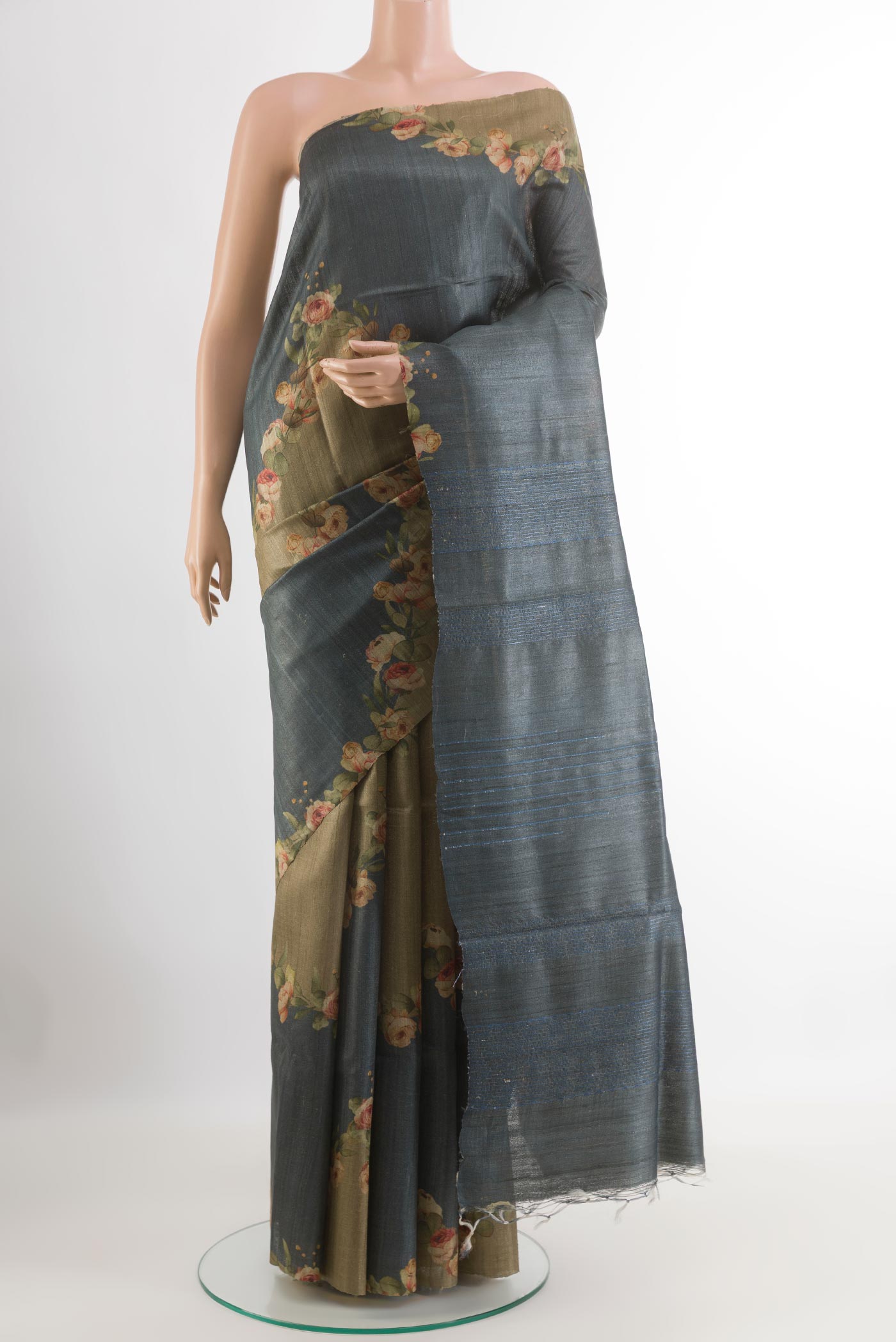 Grey Tussar Saree with Printed design on the body and Without Border.  displayed on a mannequin