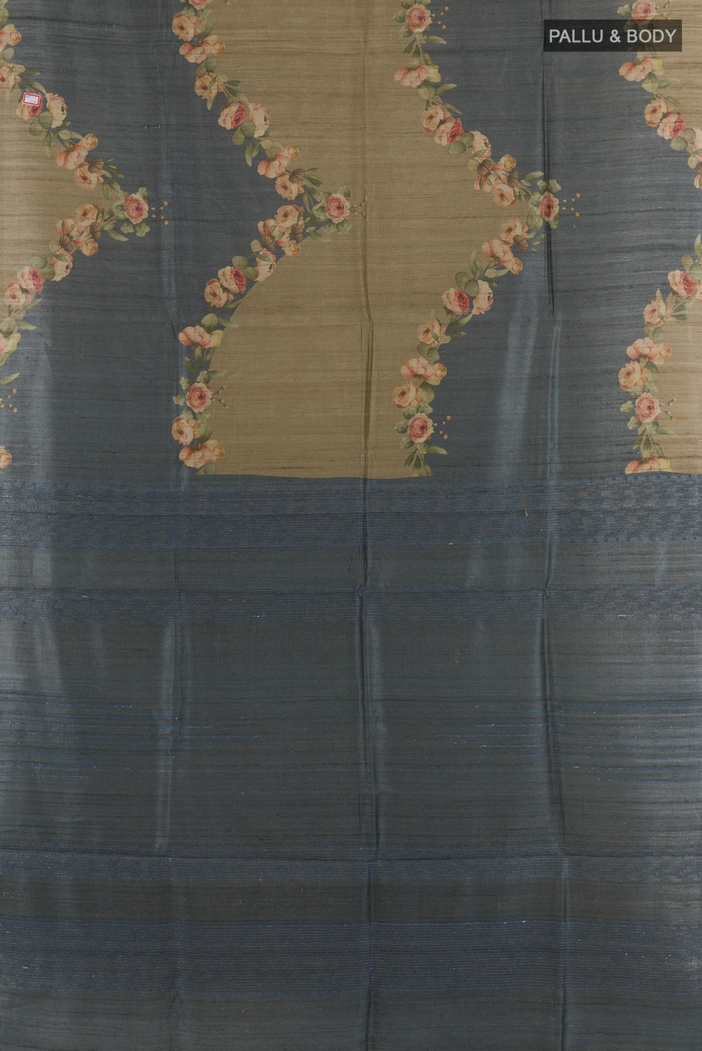 Flat view of Grey Tussar Saree with Printed design on the body and Without Border. 