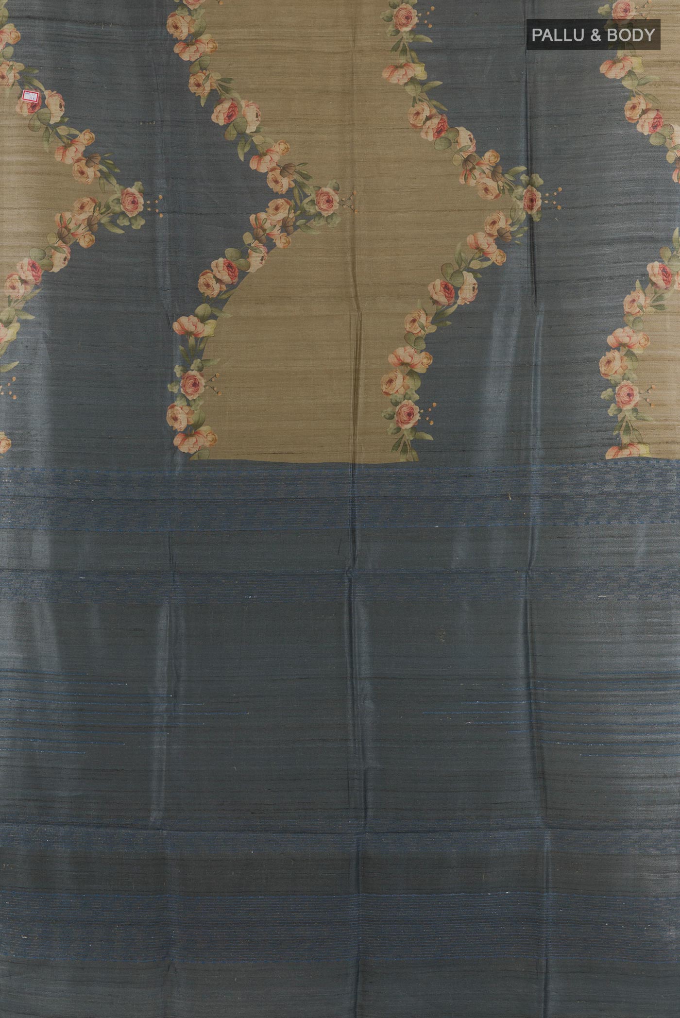 Flat view of Grey Tussar Saree with Printed design on the body and Without Border. 