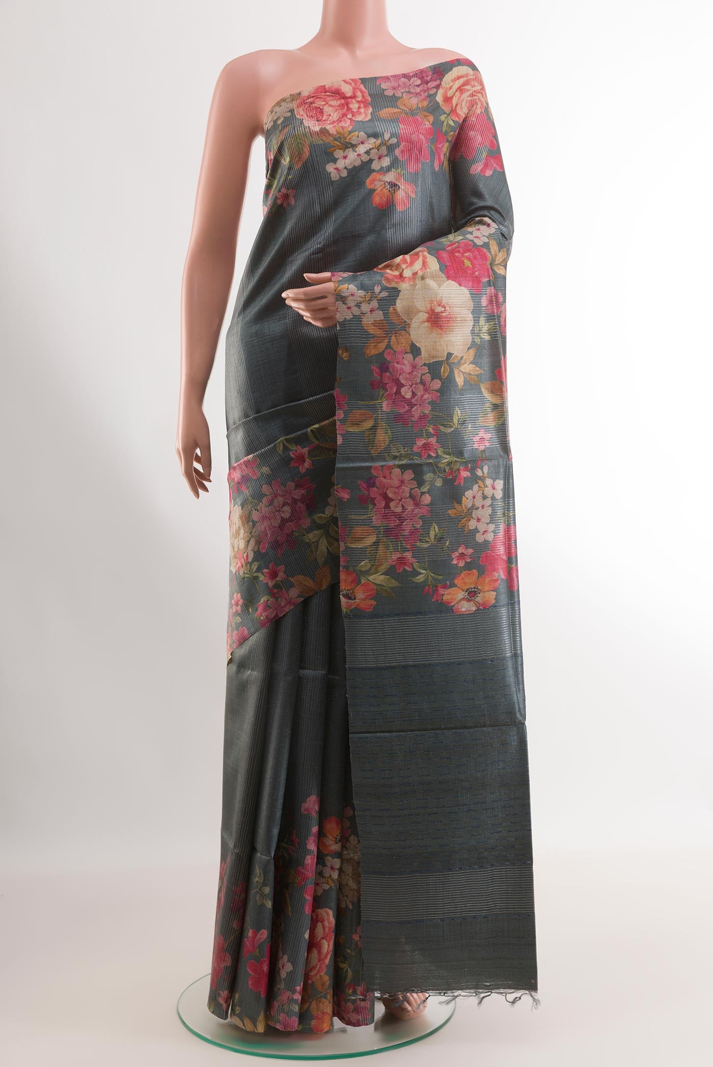 Grey Tussar Silk Saree with Stripes on the body and Printed Border.  displayed on a mannequin